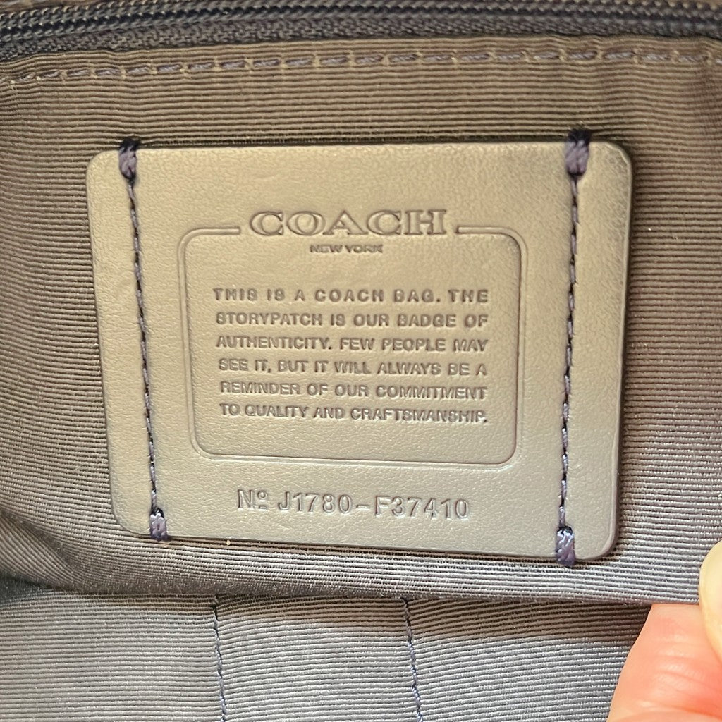 Coach Navy Leather Front Logo Drawstring Turn Lock Pocket Backpack Like New