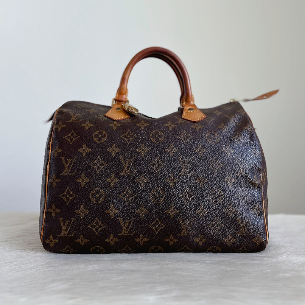 Louis Vuitton Signature Monogram Speedy 30 Bag + Lock & Keys